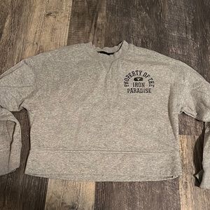 Slightly cropped under armour crew neck.